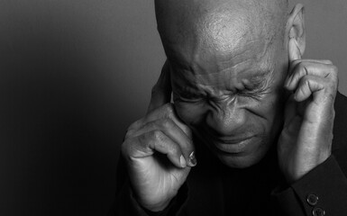 suffering from deafness and hearing loss on grey background with people stock image stock photo	