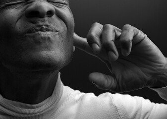 suffering from deafness and hearing loss on grey background with people stock image stock photo	