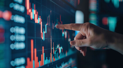 hand of a businessman pointing at a candle stick graph chart of stock market investment trading app. data analytics and strategy formulation