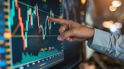 hand of a businessman pointing at a candle stick graph chart of stock market investment trading app. data analytics and strategy formulation