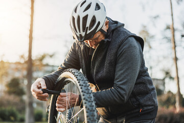 Man Fixing Bicycle Tire