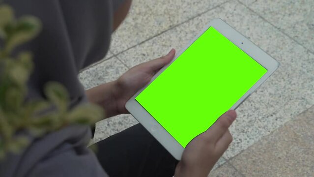 close up shot of multiple devices with green screen