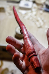 Obraz premium Wooden magic wand in hand, hand-crafted