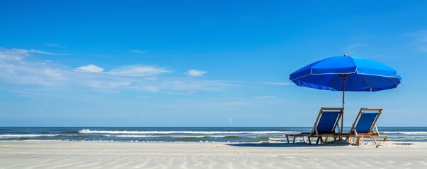 Serene beach getaway - umbrella and lounge chairs