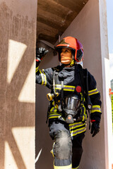 An adult Caucasian woman works as a firefighter dressed in uniform.The senior woman is resting...