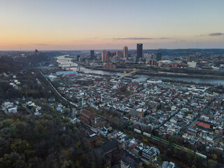 Fototapeta na wymiar Aerial cityscape with river at sunset during fall and residential Pittsburgh Pennsylvania