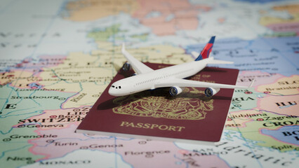 tourism travel concept, plane over a passport and a map