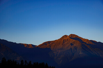 Fiery Sunrise Over a Bare Austrian Mountain