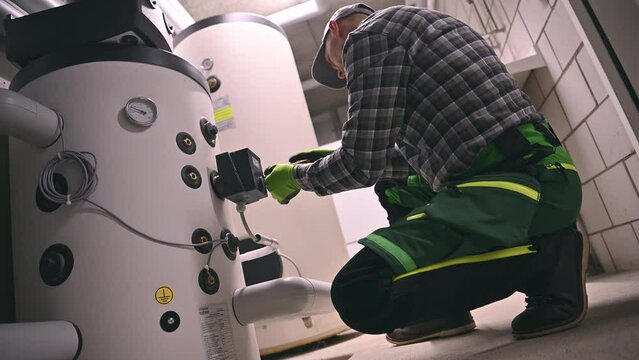 Plumber Fixing Water Heating Boiler