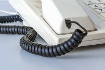 Cord and connector for a telephone set from the 80s and 90s. Close-up