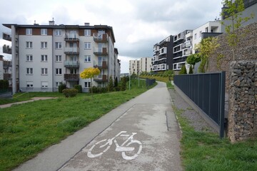 A bicycle road running through a newly built housing estate in early spring.