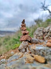 A pyramid of pebbles on a stone