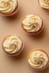 Group of cupcakes with cream frosting, perfect for bakery or dessert concepts