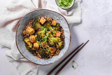 quinoa bowl with broccoli and smoked tofu cubes