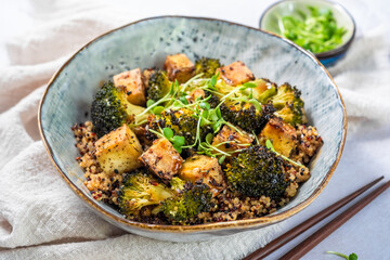 quinoa bowl with broccoli and smoked tofu cubes