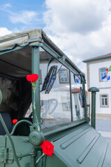 two red carnations decorating a military vehicle during the commemoration of April 25th in...