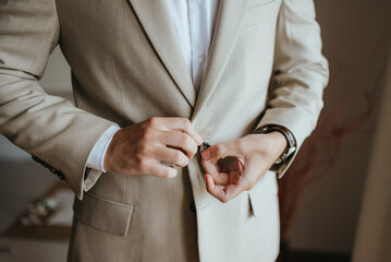 Guy is getting dressed for a business meeting.