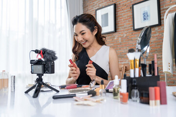 Woman influencer shoot live streaming vlog video review makeup uttermost social media or blog....