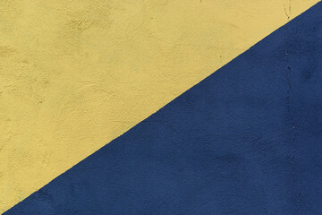 Colored paper in blue and yellow, divided in half, diagonally background 2