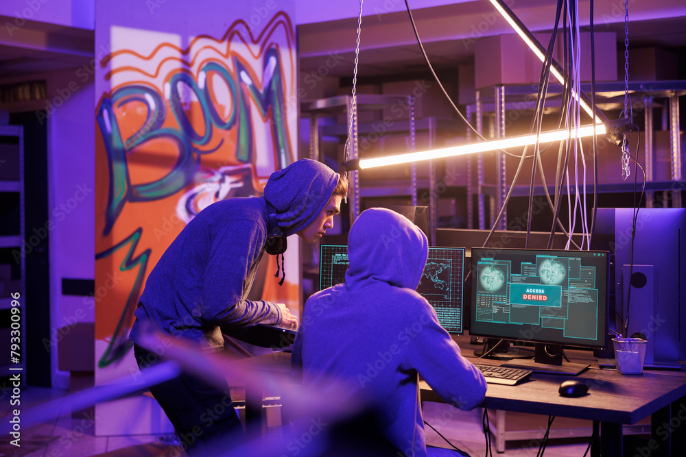 Poster criminals hacking server and getting access denied in abandoned warehouse. hackers in hoods breaking