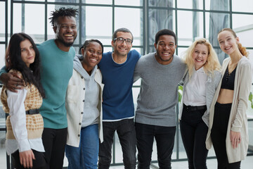 Group of business people standing at the window of a modern office