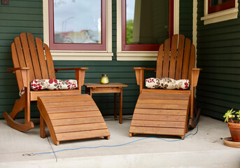 craftsman style bungalow with Adirondack chairs on the porch
