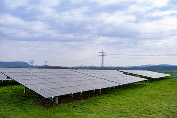 Rows photovoltaic panels stretch across solar farm, capturing sun's energy for sustainable future,...