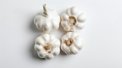 Photo of four garlic on a white background, studio shot from a low angle with natural light on a...