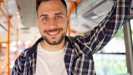 Young man riding in a bus