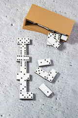 Aligned dominoes: the magic of the domino game. Concept of strategy and planning.