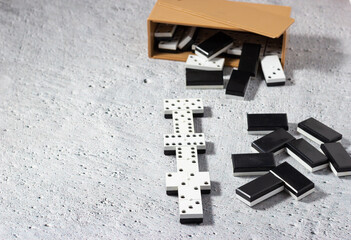Dominoes on a neutral background: Concept of business strategy.