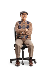 Pensioner sitting in an office chair and looking at camera