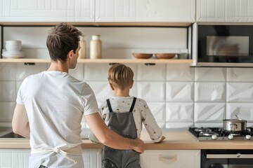 Fototapeta premium Father and son bonding over cooking in a home kitchen