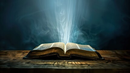 Open bible on a dark background with rays of light and smoke