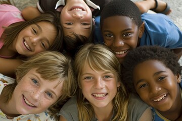 Group of kids lying on the floor smiling and looking at the camera