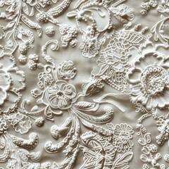 Seamless pattern of white floral embroidery on white lace fabric