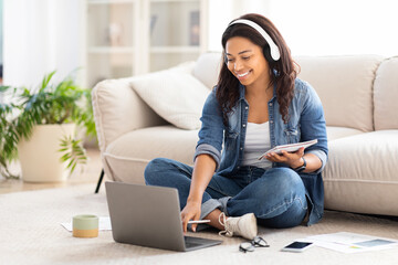 Woman Sitting on Floor Using Laptop, Studying Online