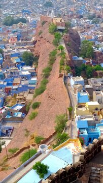 Houses of famous tourist landmark Jodhpur - the Blue City, view from Mehrangarh Fort, Rajasthan, India. Camera vertical pan