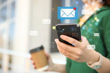 Email. Woman using mobile phone outdoors, closeup. Letter illustrations around device