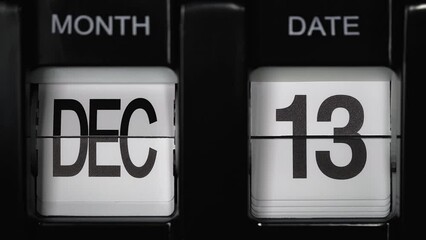 retro flip calendar with a date change from the twelfth of December to the thirteenth of December. daily calendar with a change of days of the month. calendar concept, reminders, events. close up.