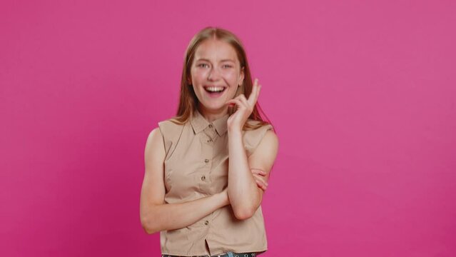 Amused lovely woman pointing finger to camera, laughing out loud, taunting making fun of ridiculous appearance, funny joke anecdote. Pretty blonde girl isolated alone on pink studio background