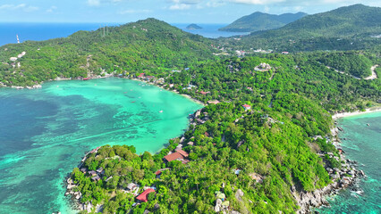 Tropical paradise in the Gulf of Thailand, Koh Tao boasts crystal-clear waters perfect for diving and snorkeling. Explore vibrant coral reefs teeming with marine life. Flying from drone.
