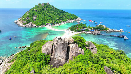 Nangyuan Island captivates with its lush greenery, azure seas, and idyllic surroundings, inviting travelers to indulge in nature's splendor. Aerial view. Koh Tao, Southern Thailand.
