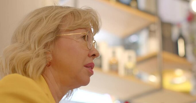Adult woman asking questions might be seeking advice, sharing ideas, or facilitating dialogue among her peers during group discussion, brainstorming session, or a networking event.