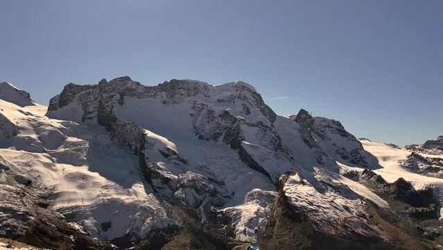 The snowy peaks of Switzerland. Mount Zermat in the sunlight from the observation deck.