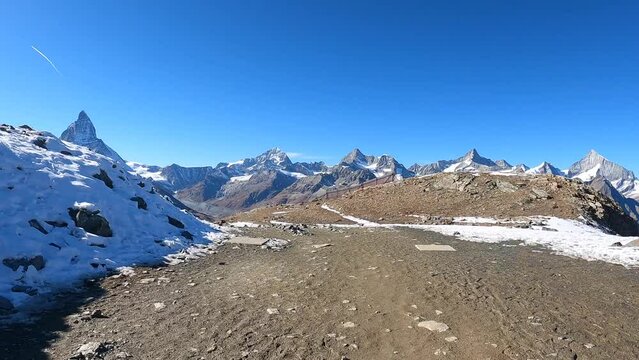 The snowy peaks of Switzerland. Mount Zermat in the sunlight from the observation deck.