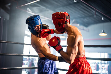 Two young professional boxer having a competition tournament on stage.