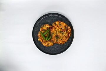Bakwan Jagung or Dadar Jagung or Dadar Jagung Manado, is Manadonese style of corn fritters. Savoury...