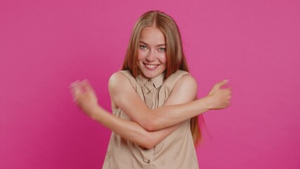 Come to me, I want to embrace you. Young woman spread hands and give hug to you. Pleasant expression, love feelings, proud, satisfied. Girl isolated alone on pink studio background. Lifestyles
