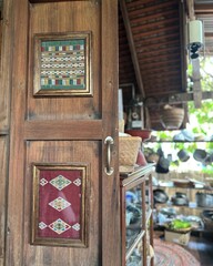 Antique wooden door in a traditional Thai kitchen
